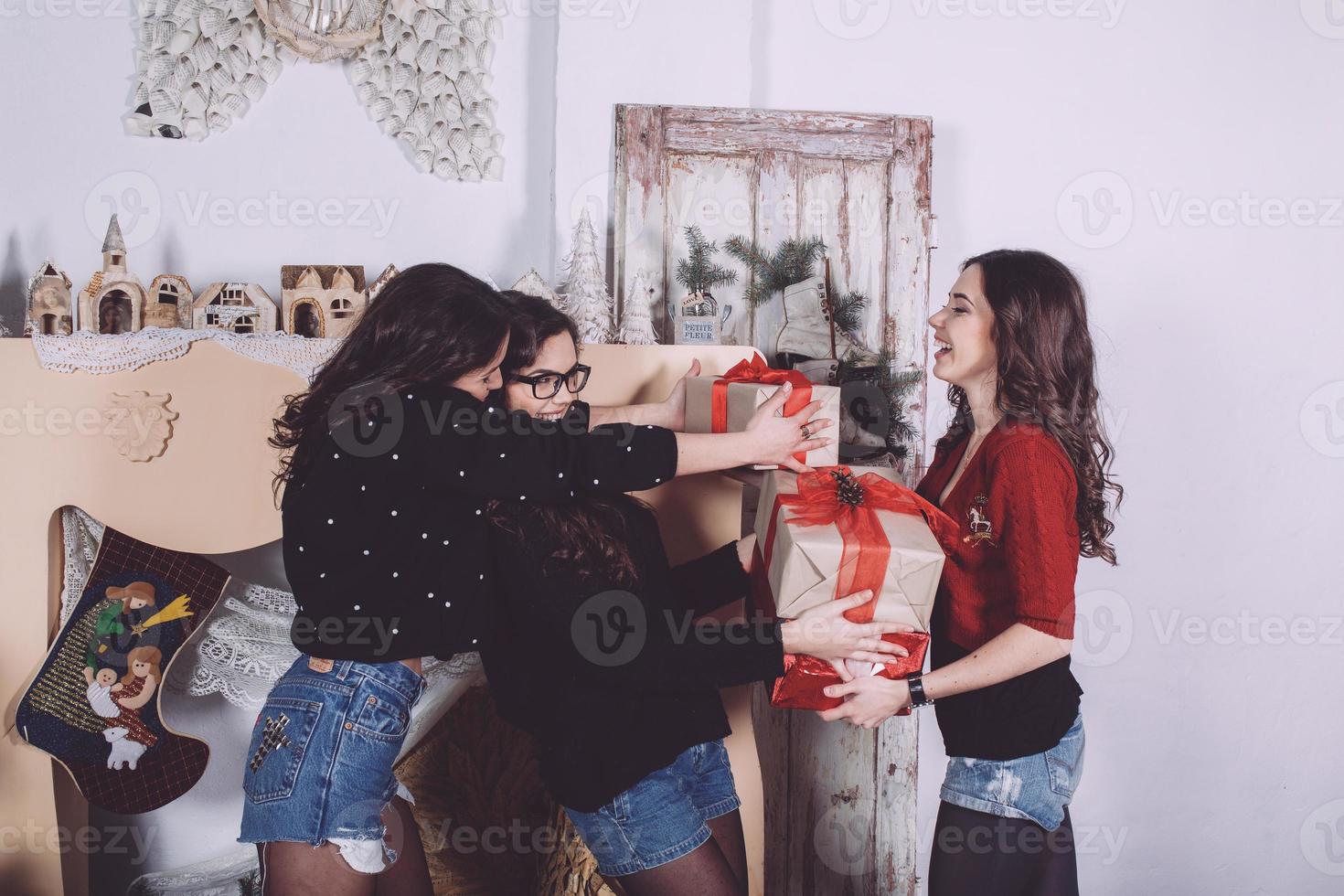 Beautiful girl exchange gifts for the new year. Decorative vintage apartment. photo