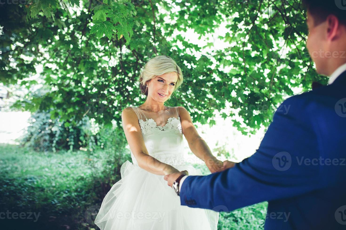 bride and groom dancing in nature photo