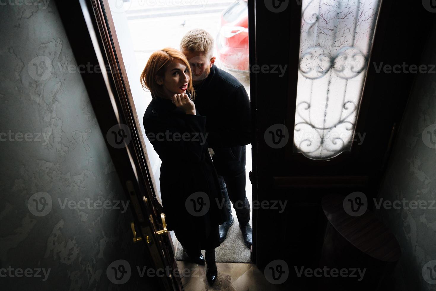 Beautiful couple posing in the doorway posing photo