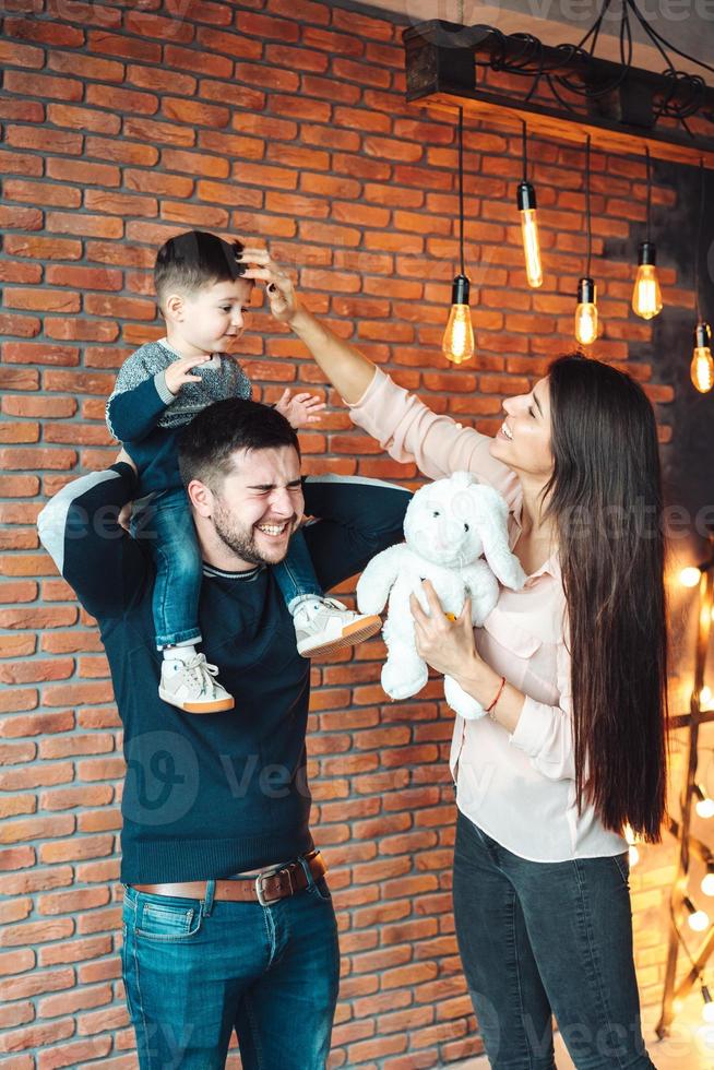 young family having fun at home photo