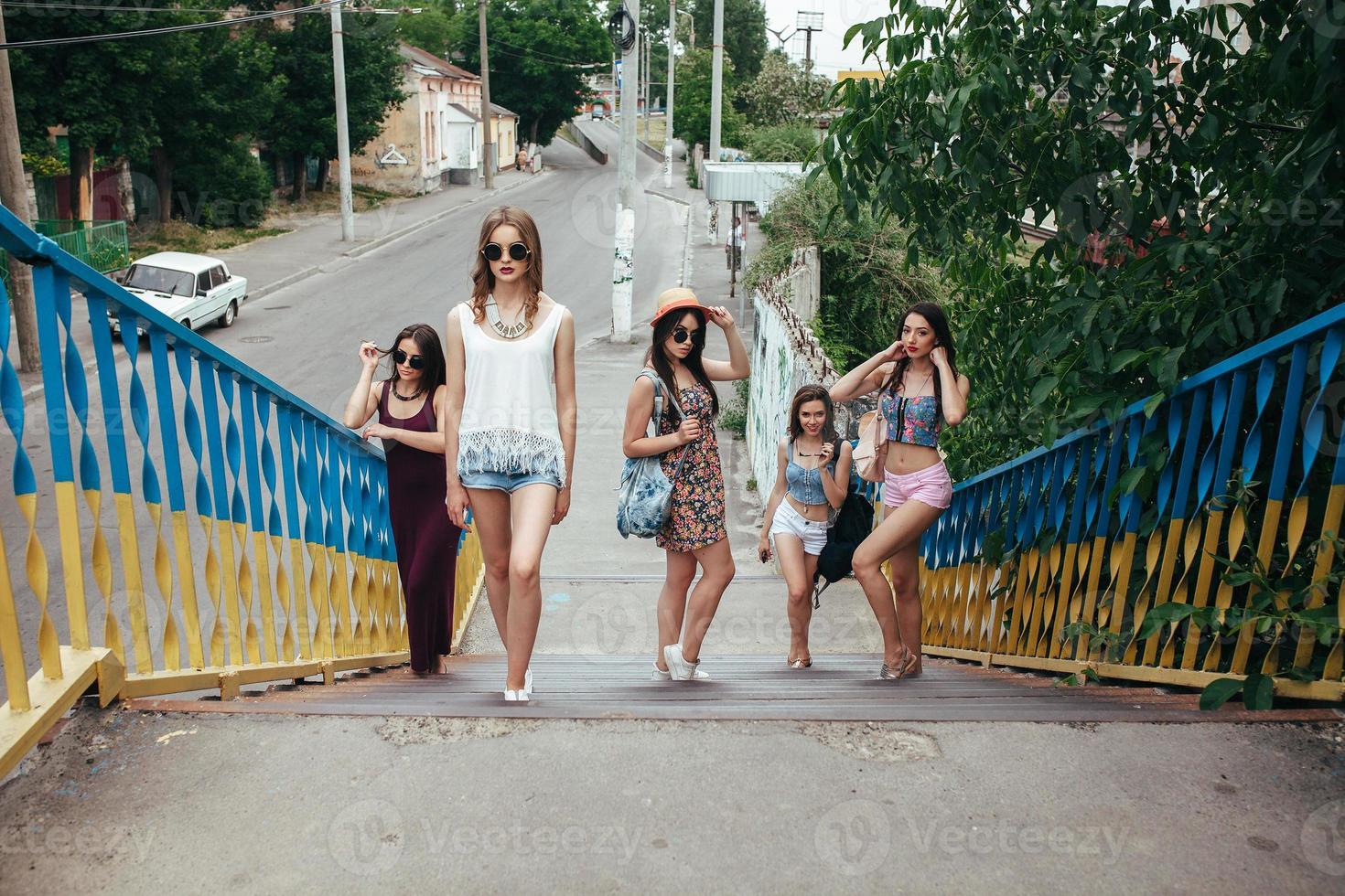 Five young beautiful girls in the city photo