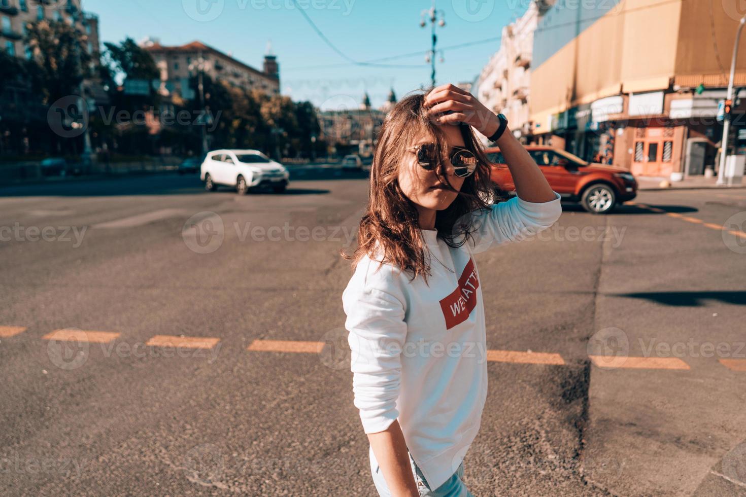 Young girl on the city street photo