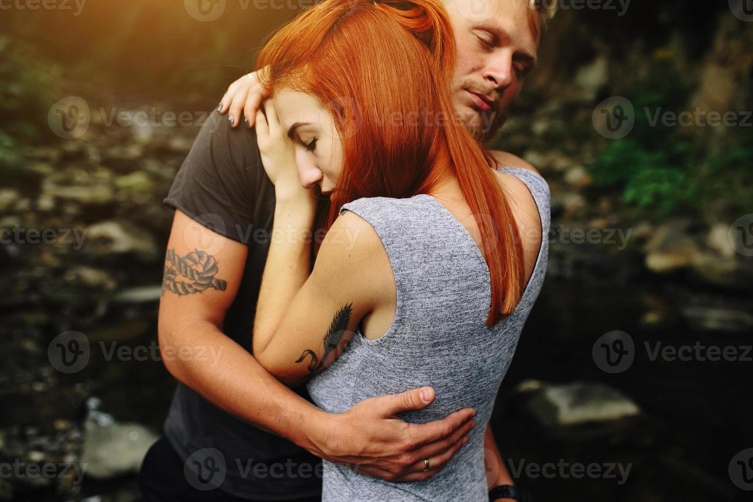 man and woman in nature photo