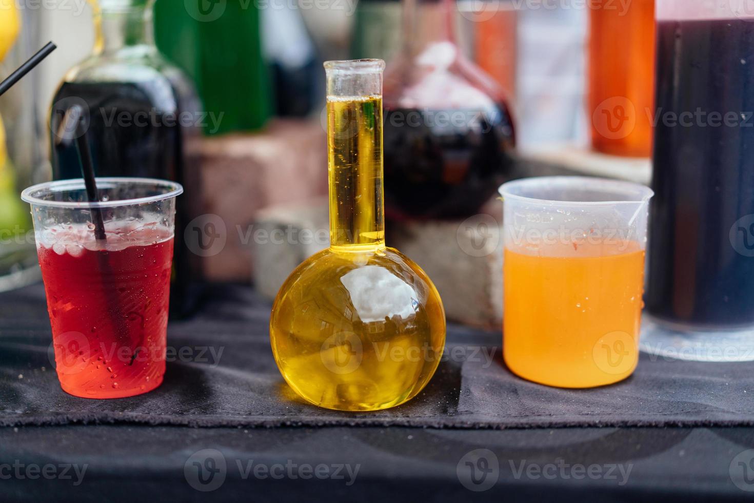 Multicolored alcoholic and non-alcoholic cocktails with straws photo