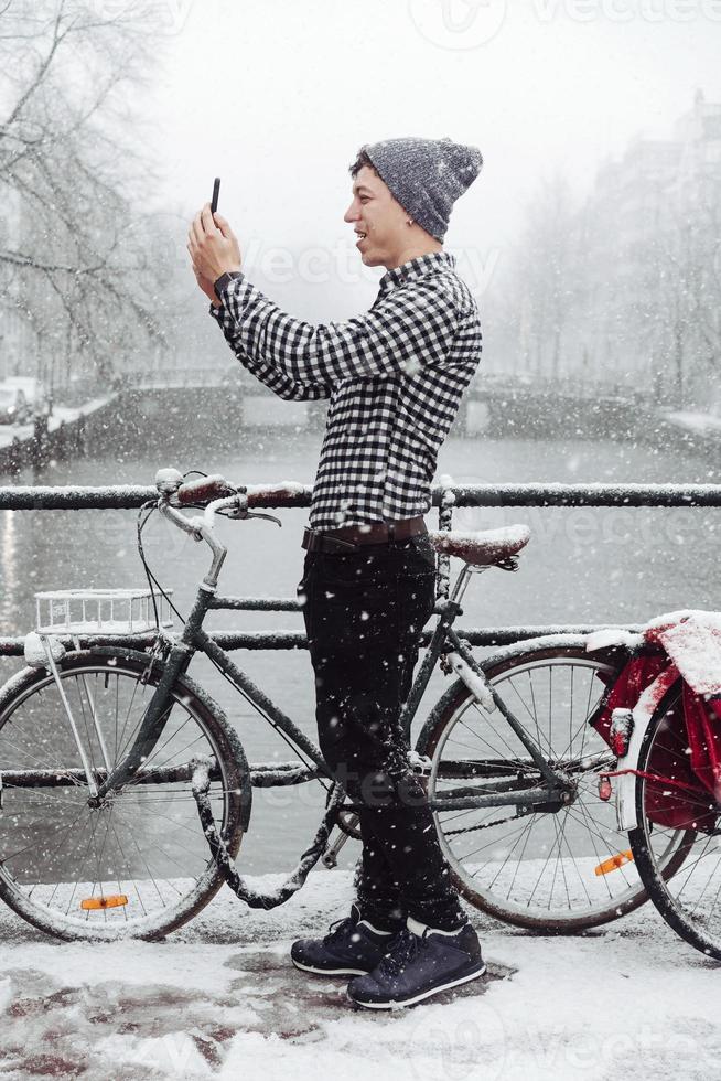 Guy is standing on a bridge photo