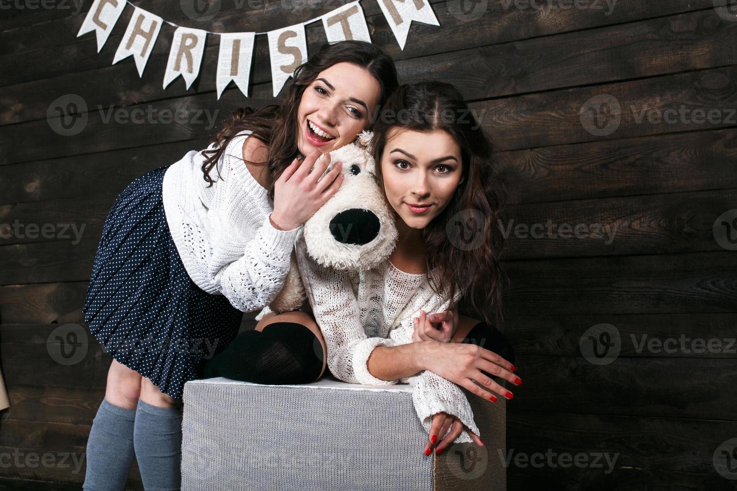 Family New Year's photos, one sister hugging each photo