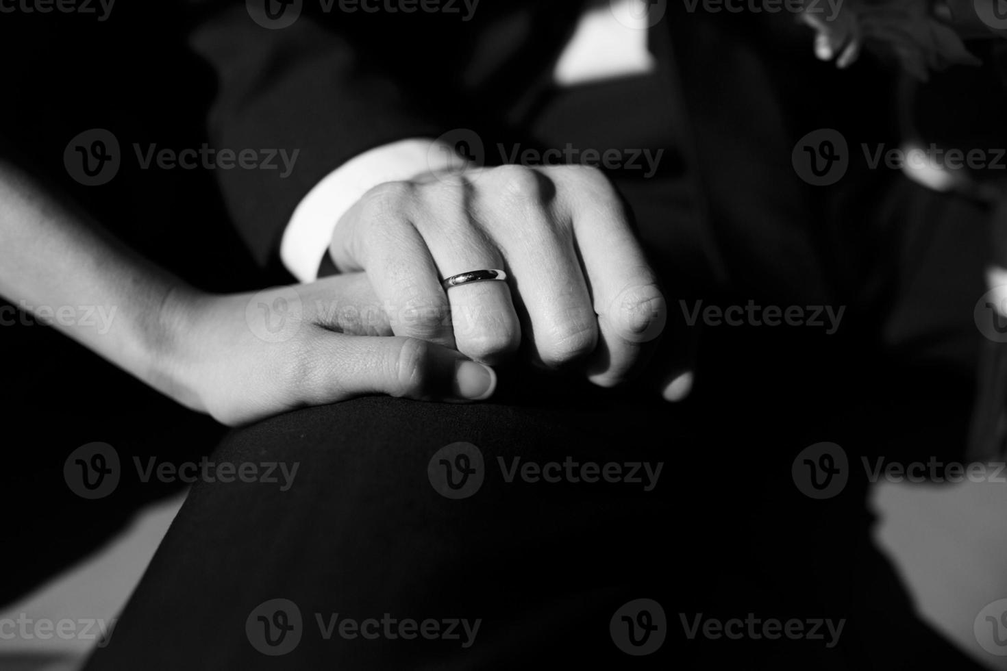 Wedding ring on hand with a sun shine. photo