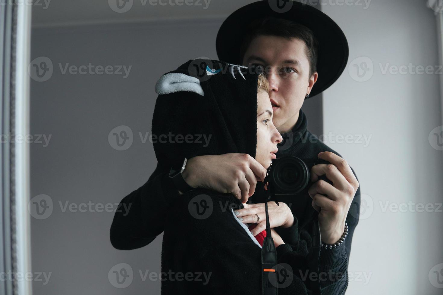 man and woman in black clothes photo