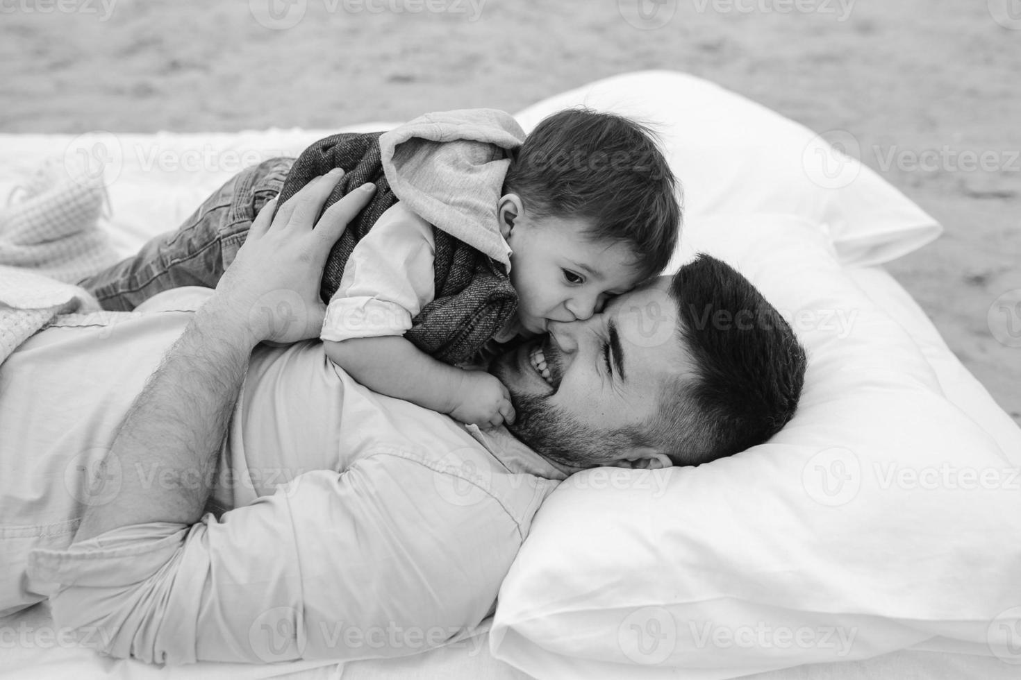 Happy family relaxing together on the mattress photo