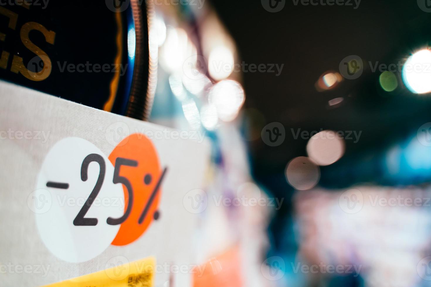 Tag with an inscription 25 percent discount, close view photo