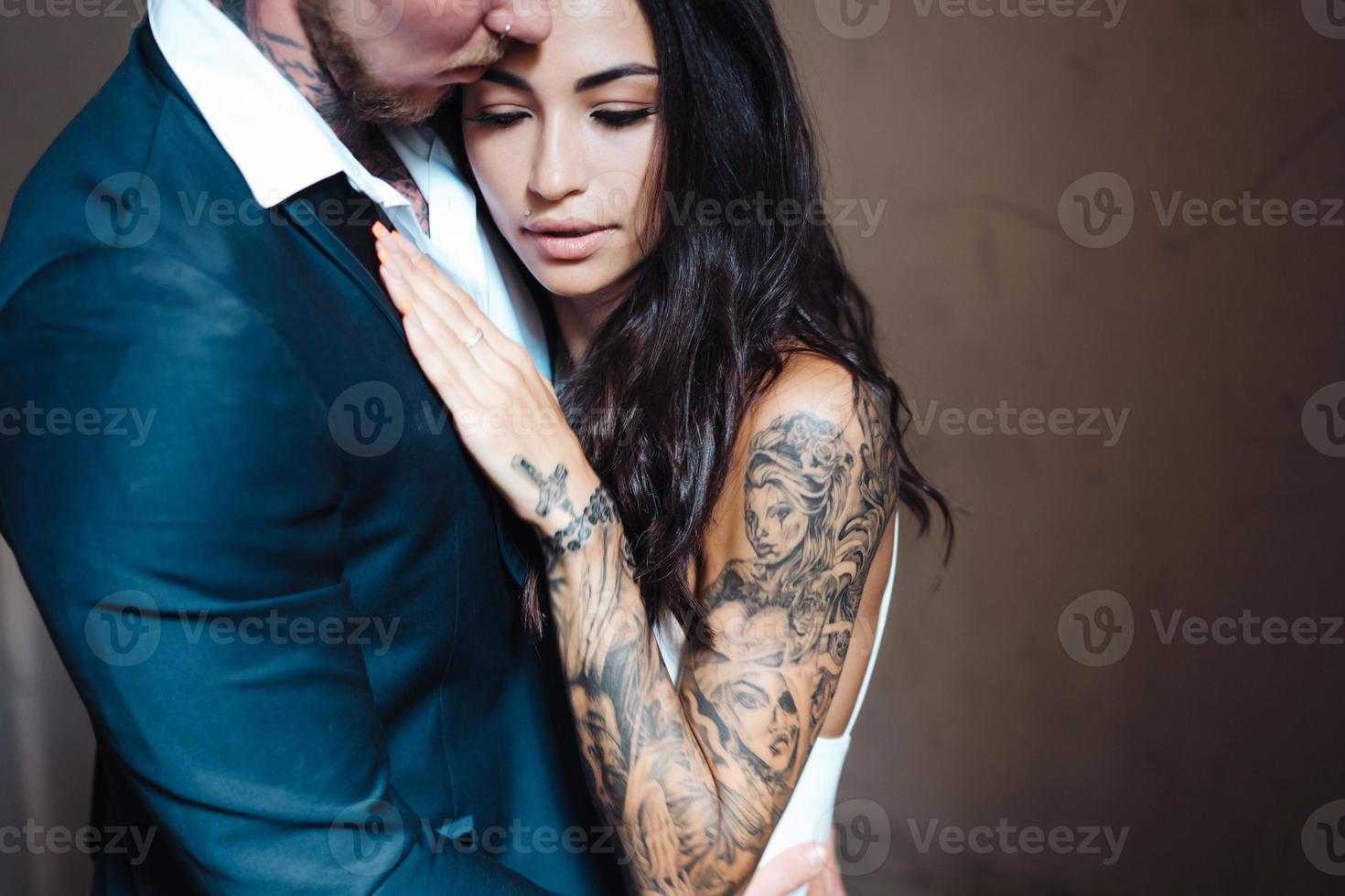 Beautiful, young couple posing on camera indoors photo