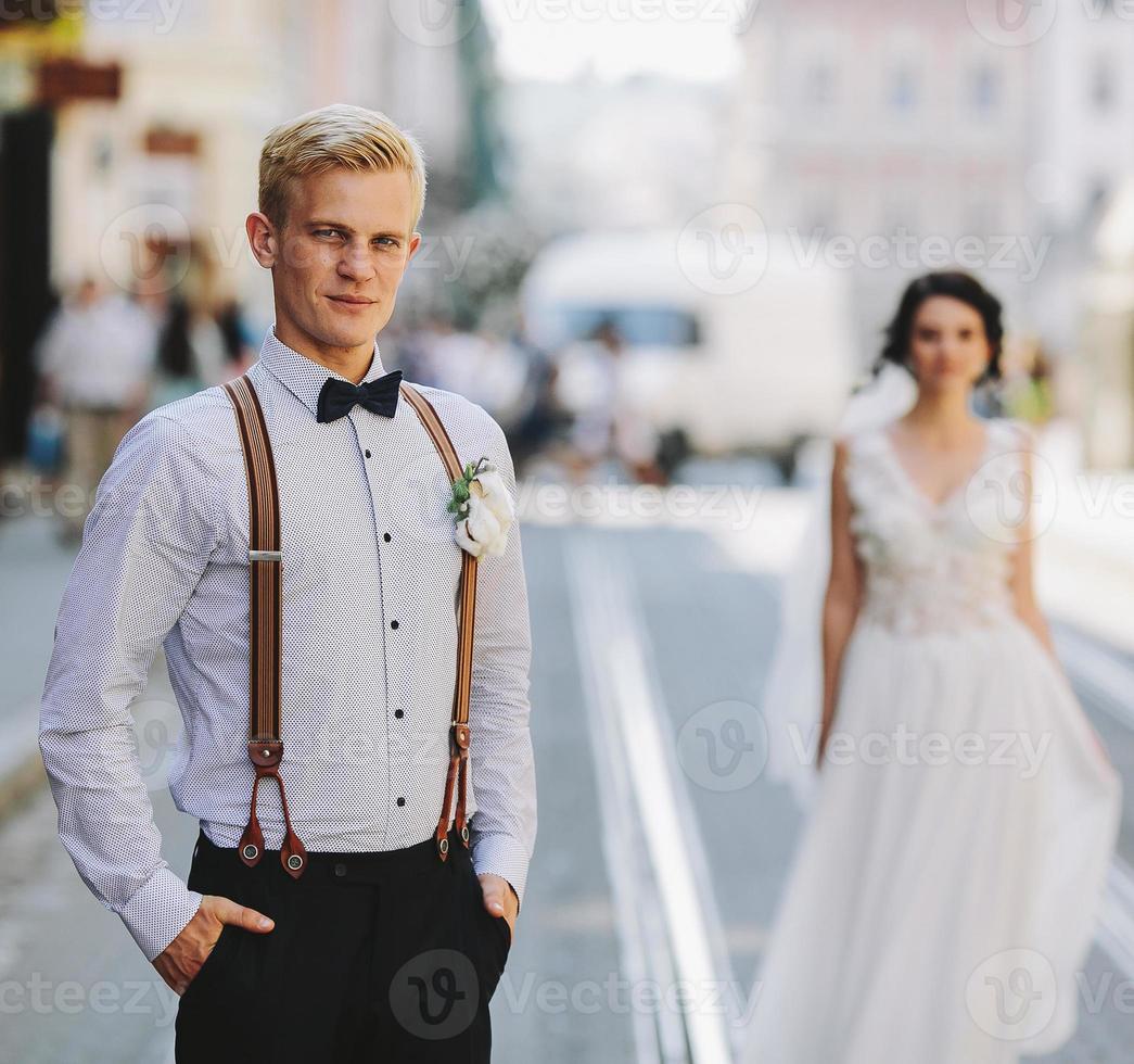 bride and groom on the street photo