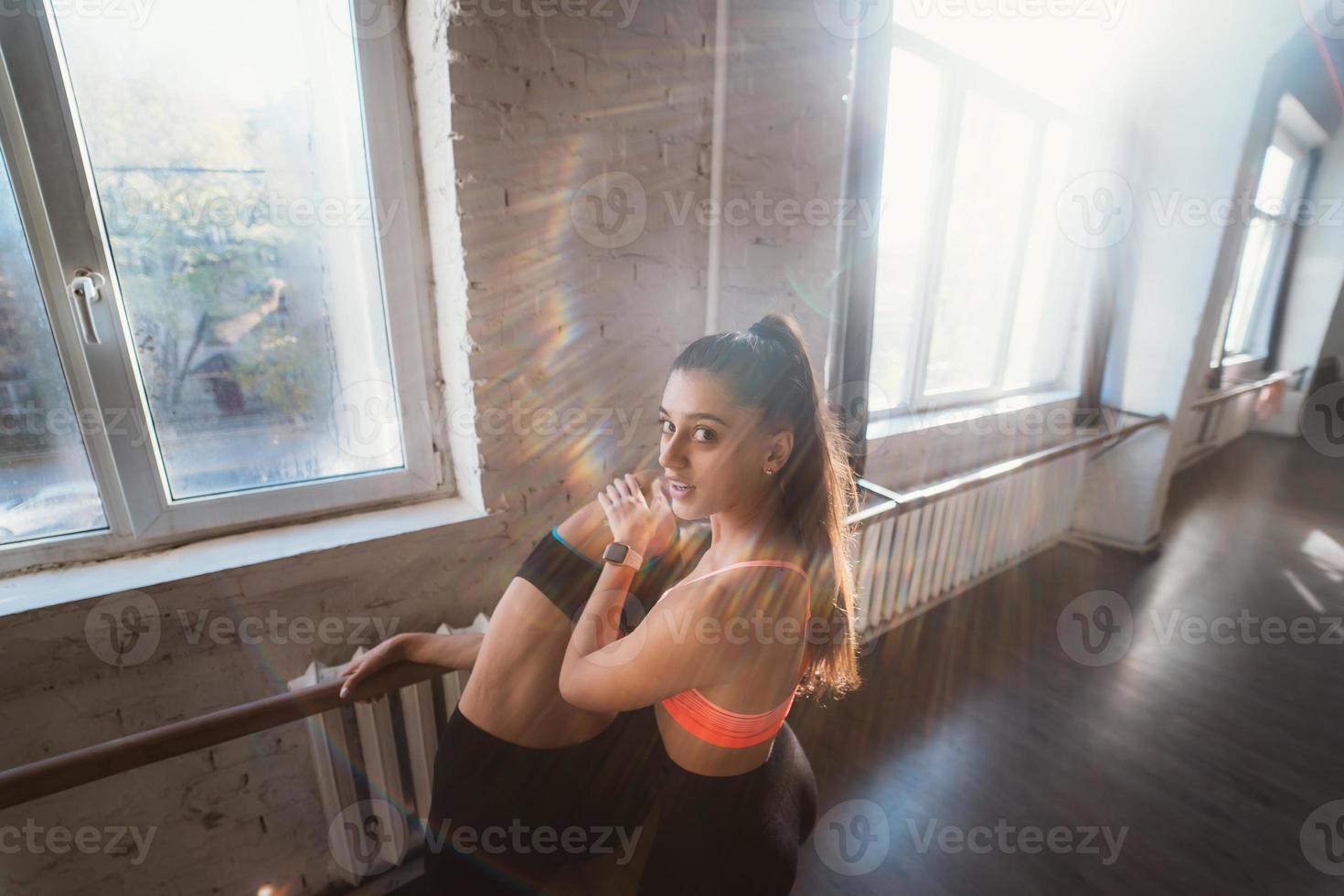 Active sportive woman stretching, young woman helping her photo