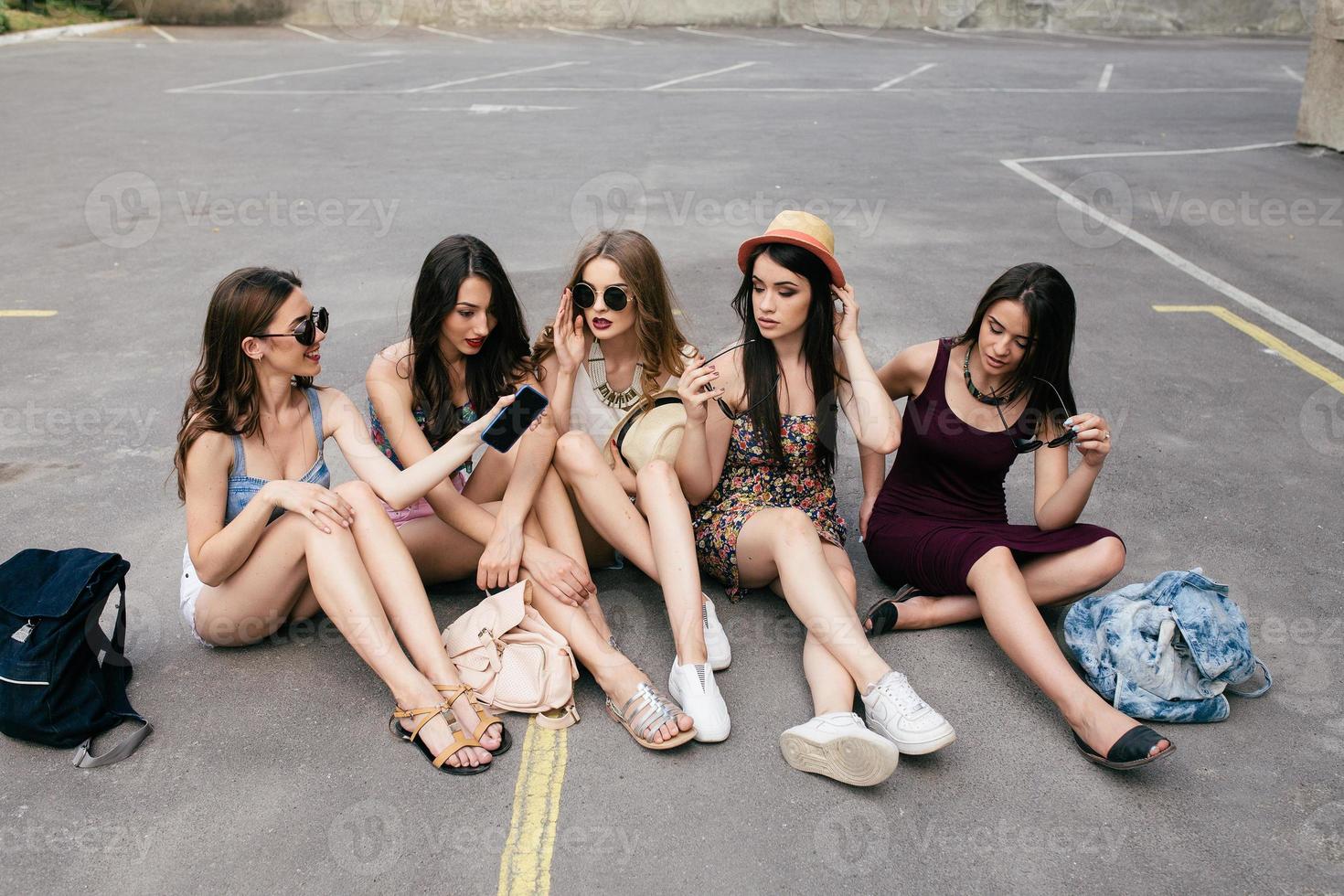 Five beautiful young girls relaxing photo