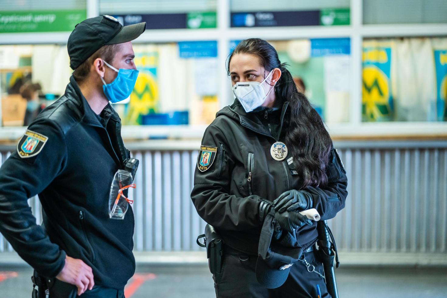 UKRAINE, KIEV - MAY 26, 2020 subway station Zoloty Vorota Golden Gate. Security people checks the flow of passengers in the metro station photo