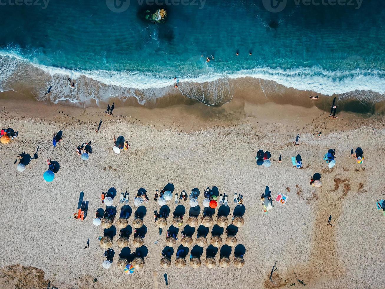 Beach with sun loungers on the coast of the ocean photo