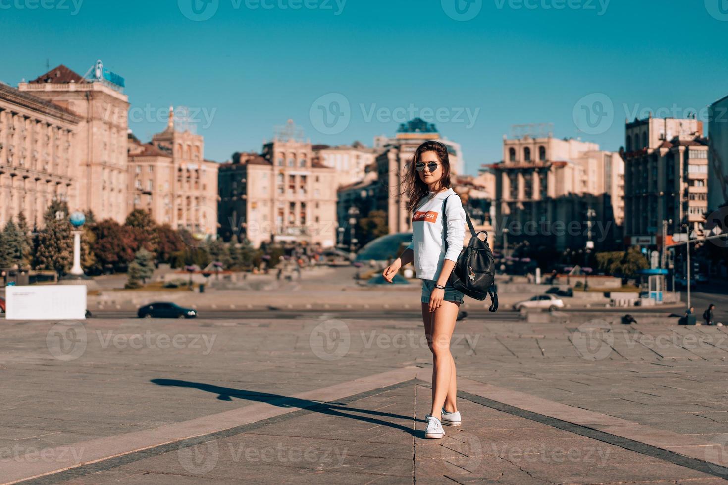 Young girl on the city street photo