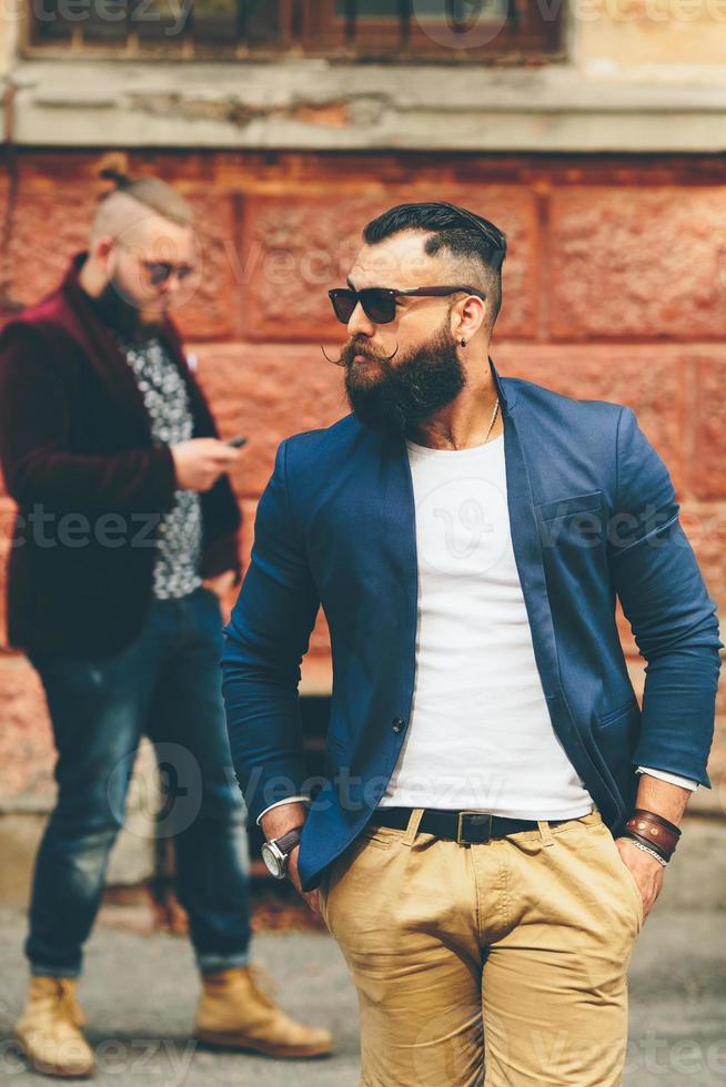 two bearded men on the background of each other photo