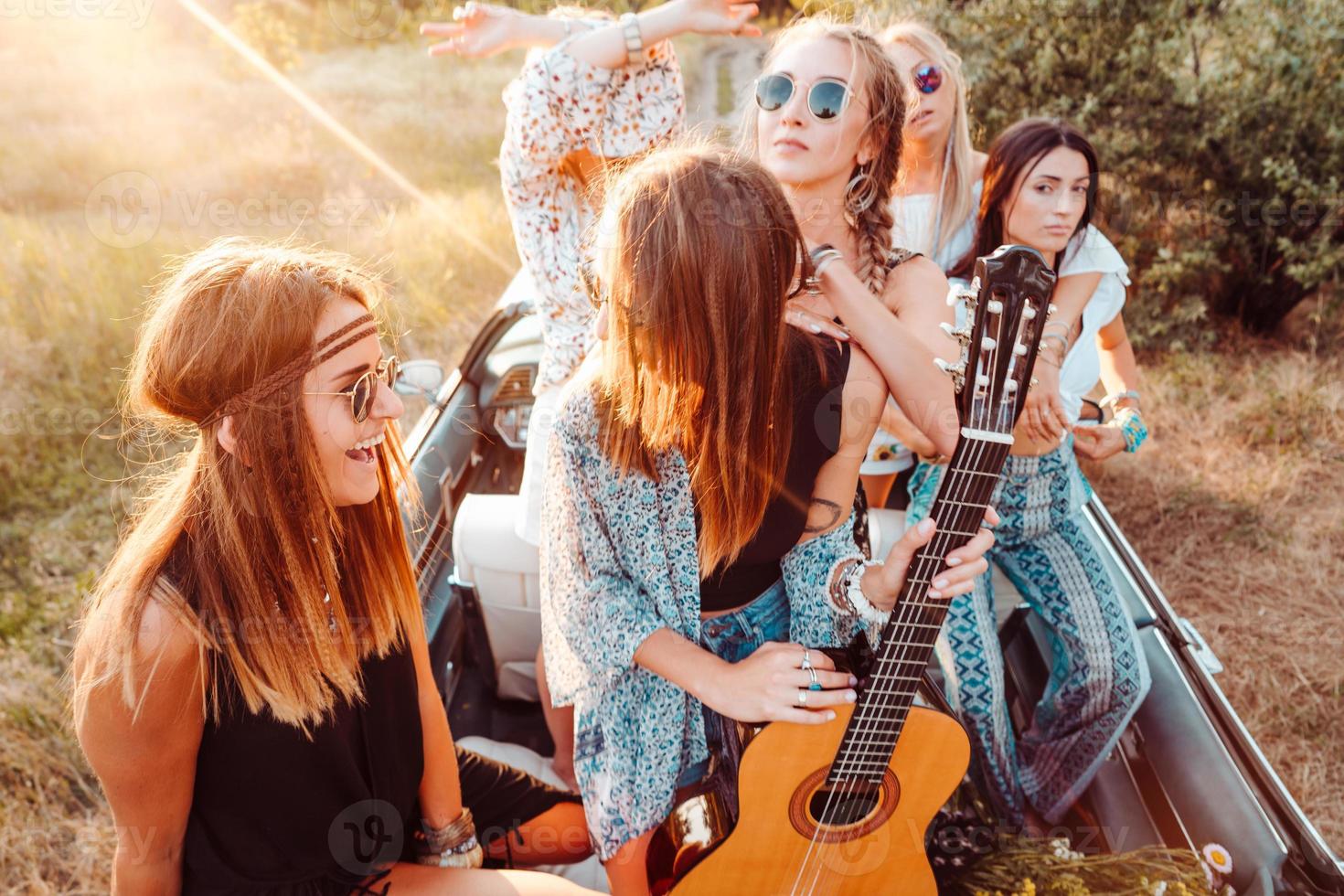 Five girls have fun in the countryside photo