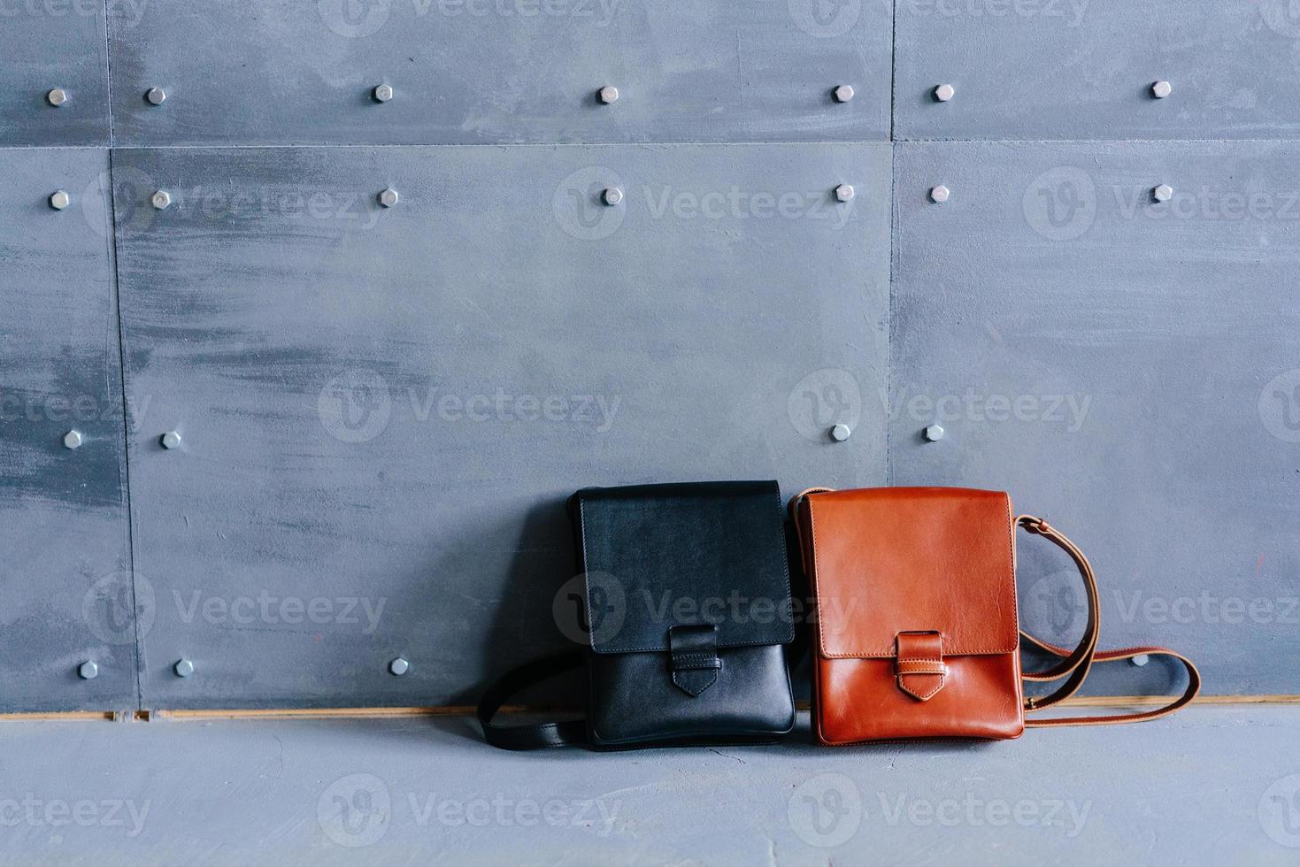 two leather bags on a gray background photo