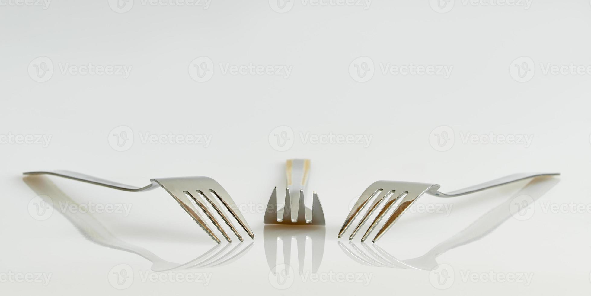 Three forks and reflection photo