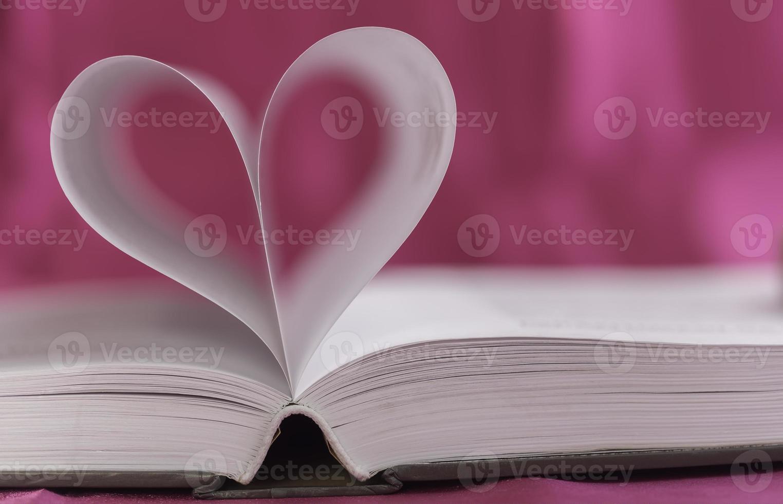 Open book with heart shape photo