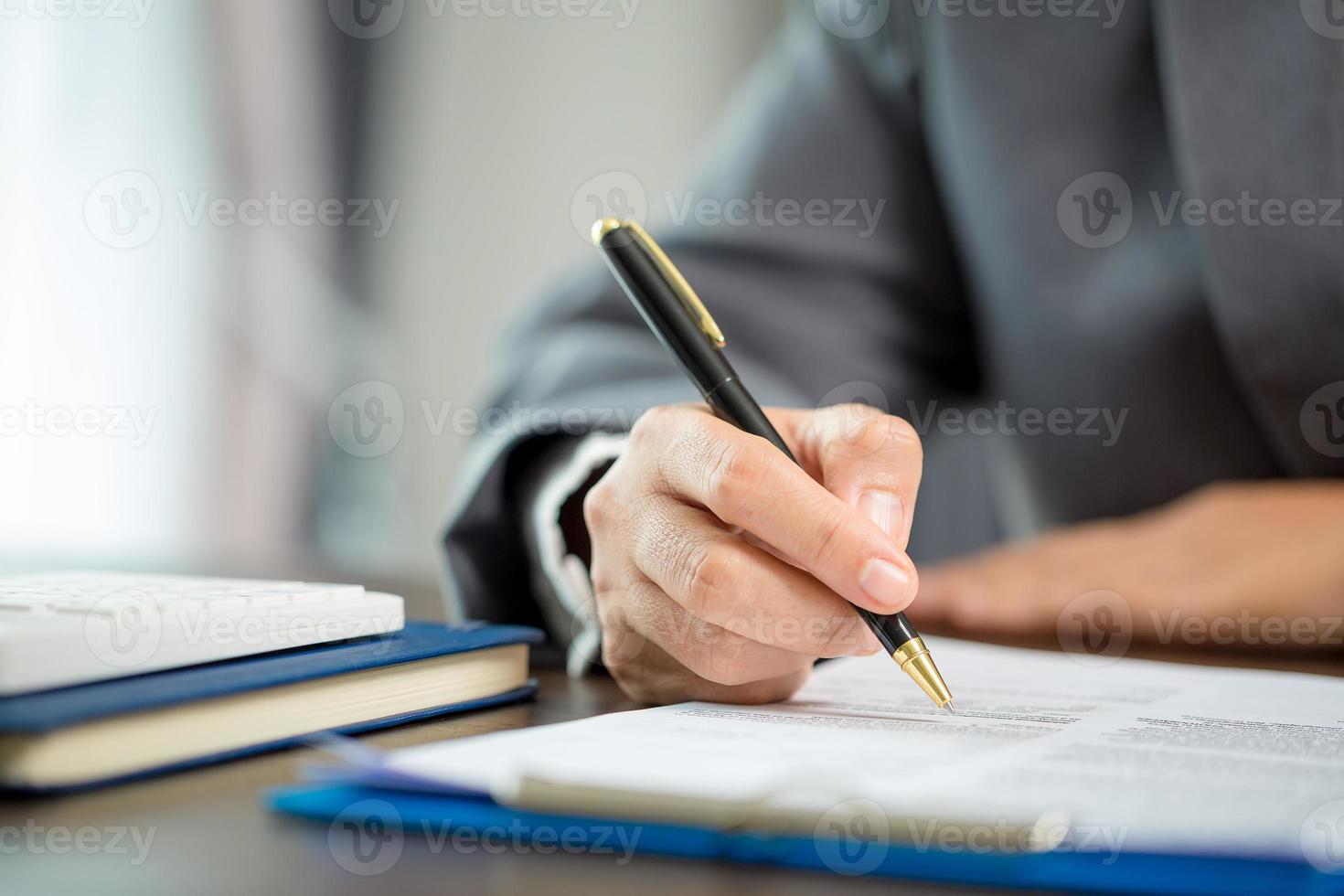 Woman home sales person is checking documents for house purchase contract before letting the customer sign contract on table is key with house model, real estate trading and insurance property concept photo