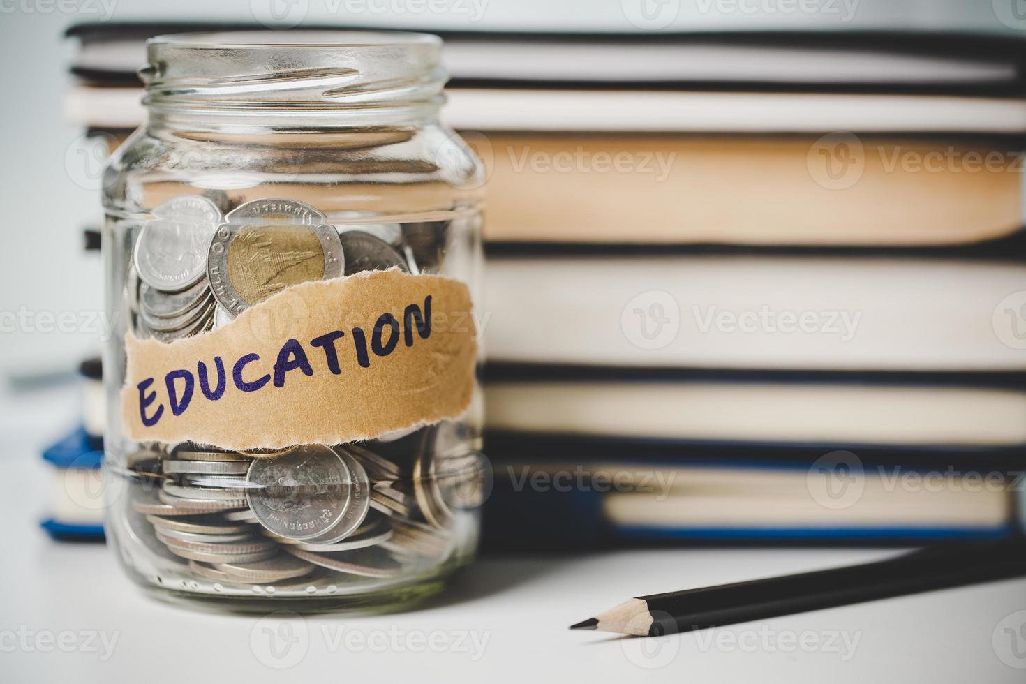 close-up education object with stack money coin-cash dollar and glass jar on background. Concept to saving money income for study, Calculating student finance costs and investment budget loan photo