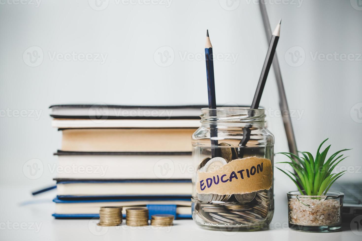 close-up education object with stack money coin-cash dollar and glass jar on background. Concept to saving money income for study, Calculating student finance costs and investment budget loan photo