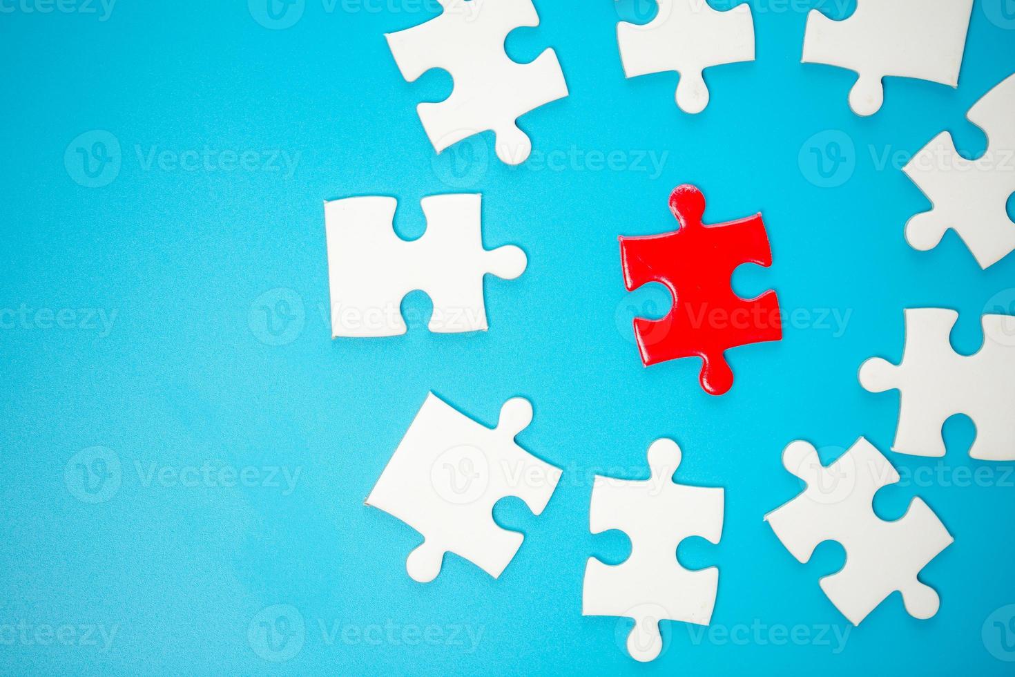 White part of jigsaw puzzle pieces on blue background. concepts of problem solving, business success, teamwork, Team playing jigsaw game incomplete, Texture photo with copy space for text
