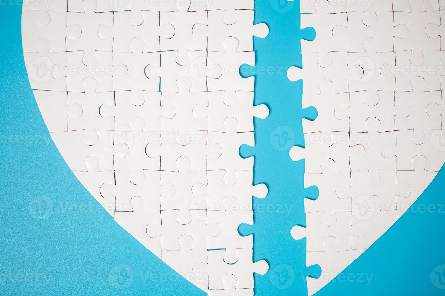 White part of jigsaw puzzle pieces on blue background. concepts of problem solving, business success, teamwork, Team playing jigsaw game incomplete, Texture photo with copy space for text
