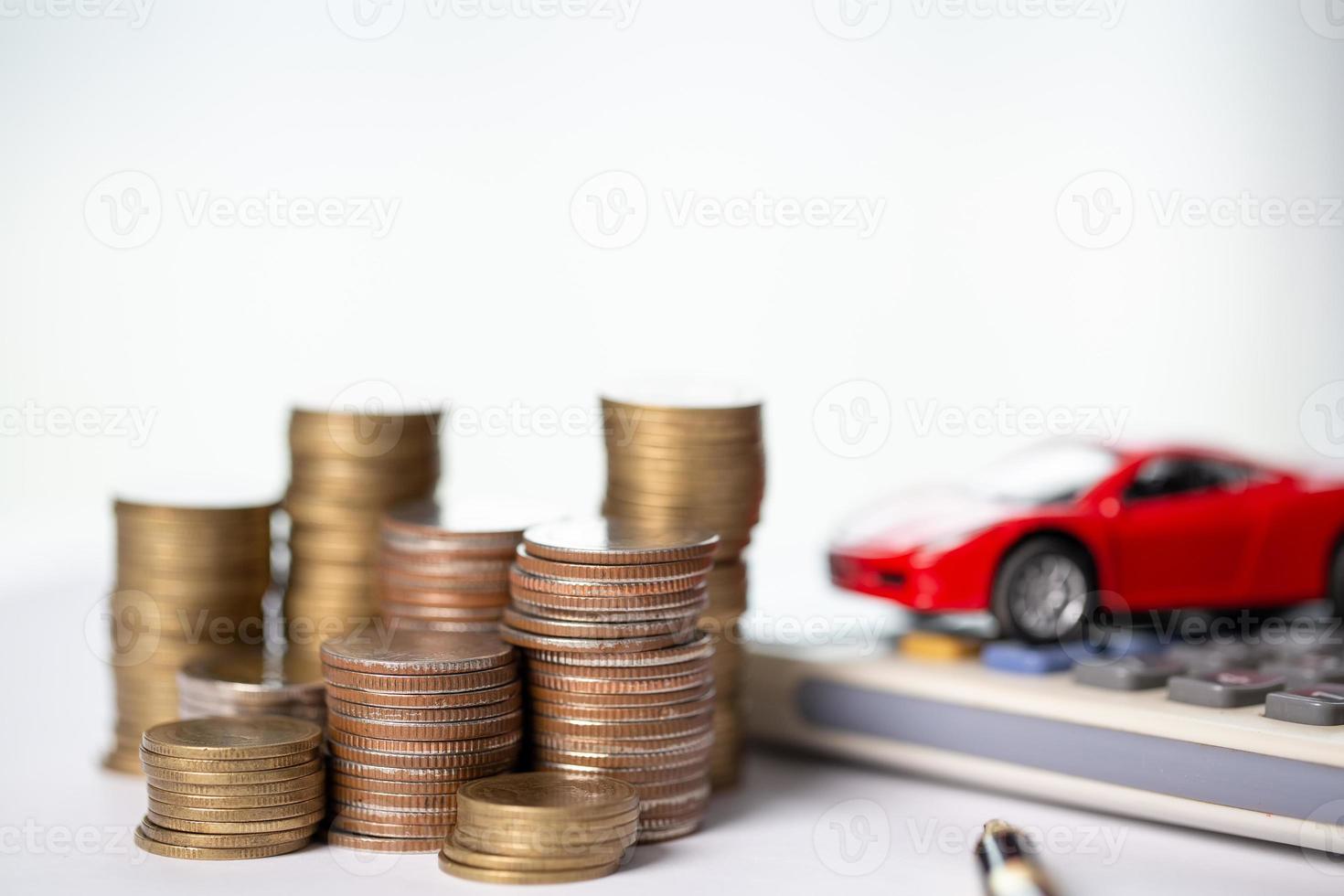 Car toy vehicle with stack coin money on background. Planning to manage transportation finance costs. Concept of car insurance business, saving buy - sale with tax and loan for new car. photo
