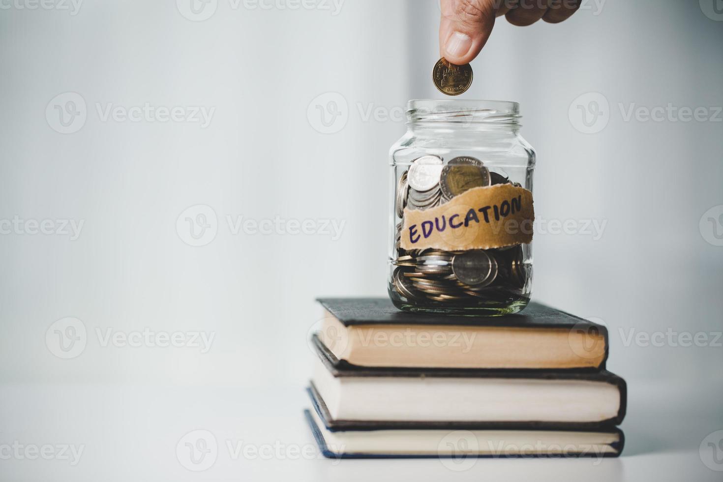 close-up education object with stack money coin-cash dollar and glass jar on background. Concept to saving money income for study, Calculating student finance costs and investment budget loan photo