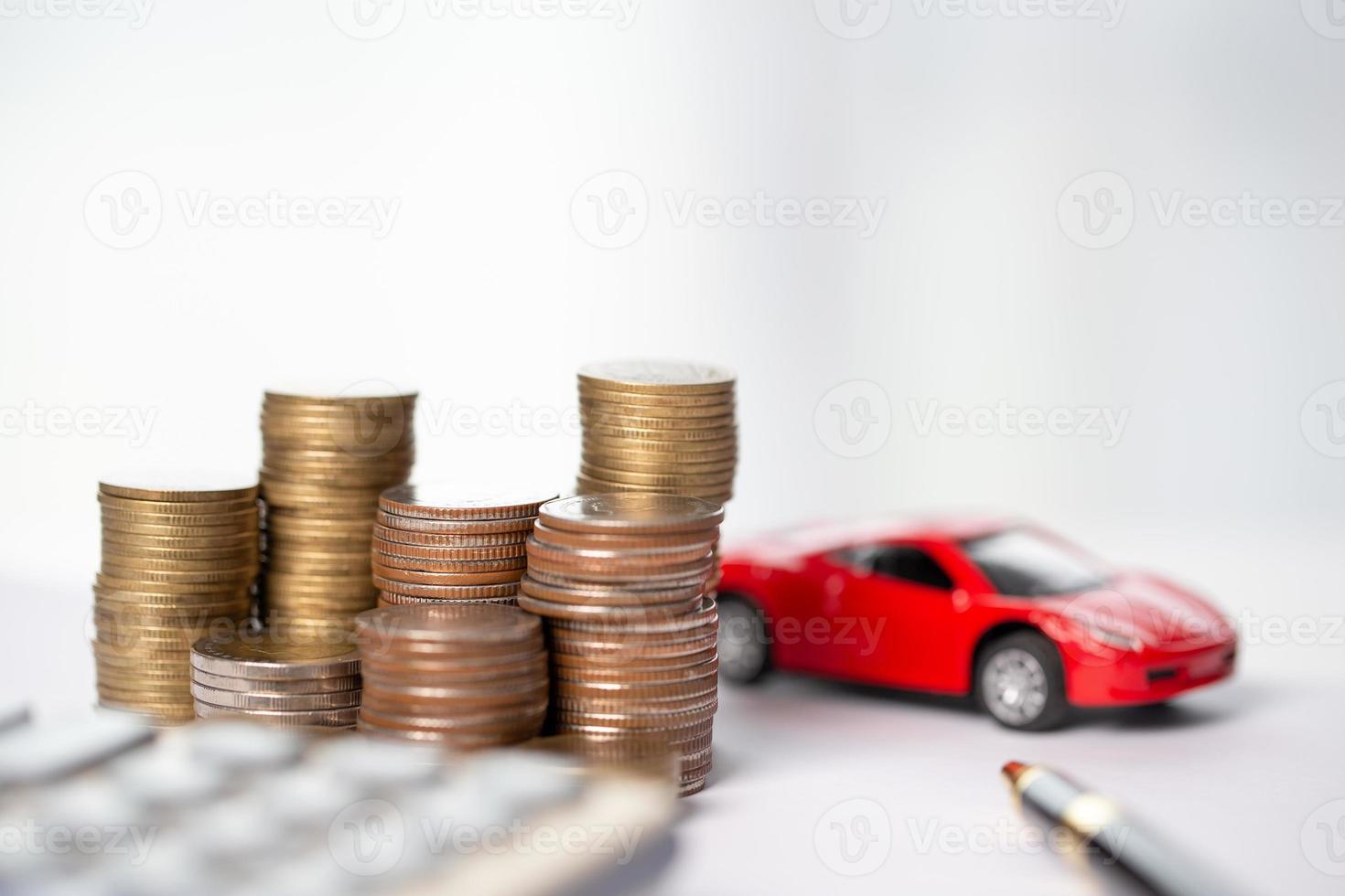 Car toy vehicle with stack coin money on background. Planning to manage transportation finance costs. Concept of car insurance business, saving buy - sale with tax and loan for new car. photo