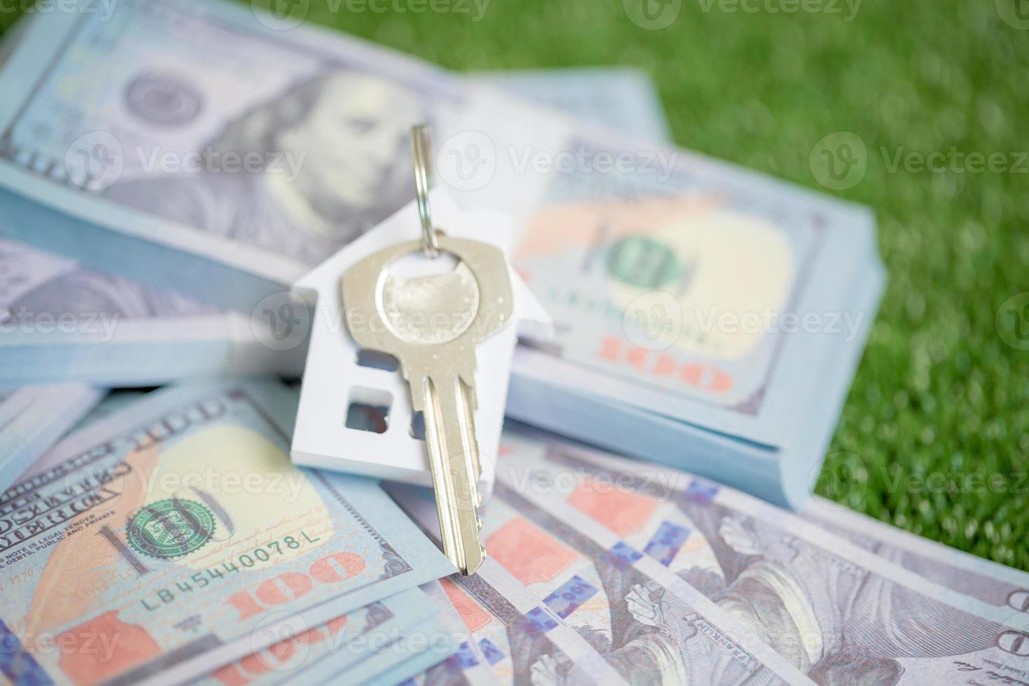 house property mortgage with cash money dollar bill on table concept of business finance, saving for buy home, investment loan, american currency, sale estate, bank payment, sell-rent real estate photo