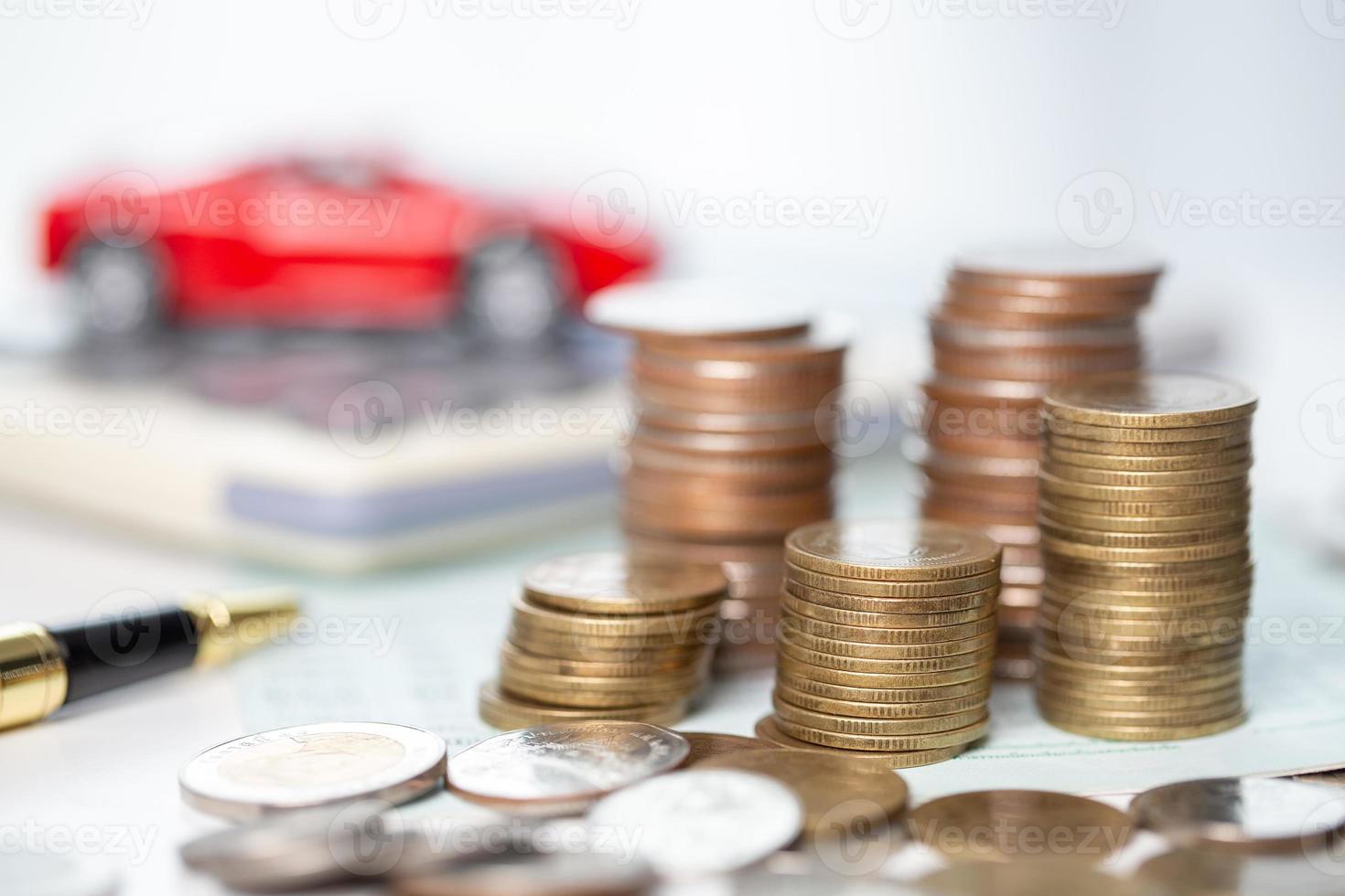 Car toy vehicle with stack coin money on background. Planning to manage transportation finance costs. Concept of car insurance business, saving buy - sale with tax and loan for new car. photo