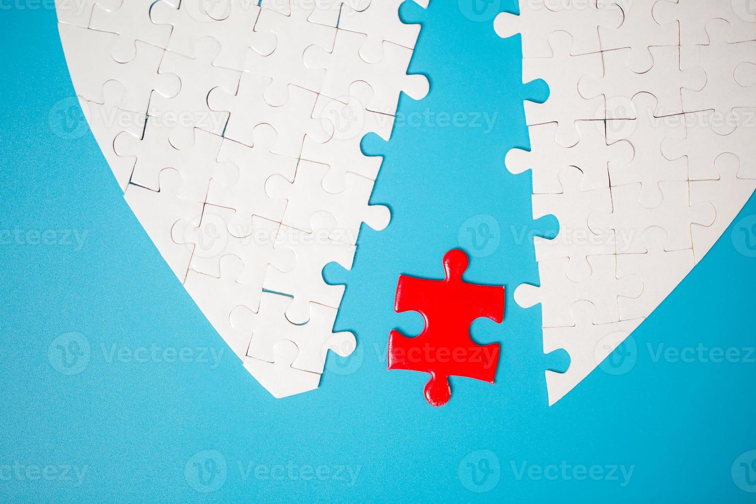 White part of jigsaw puzzle pieces on blue background. concepts of problem solving, business success, teamwork, Team playing jigsaw game incomplete, Texture photo with copy space for text