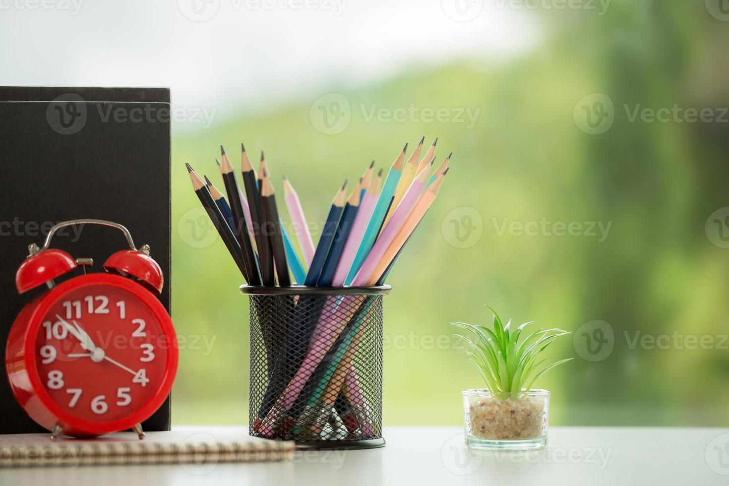Object education green nature background with stack of ancient books or old bible, open paper book on wooden table with copy space. concept of back to school, research study photo