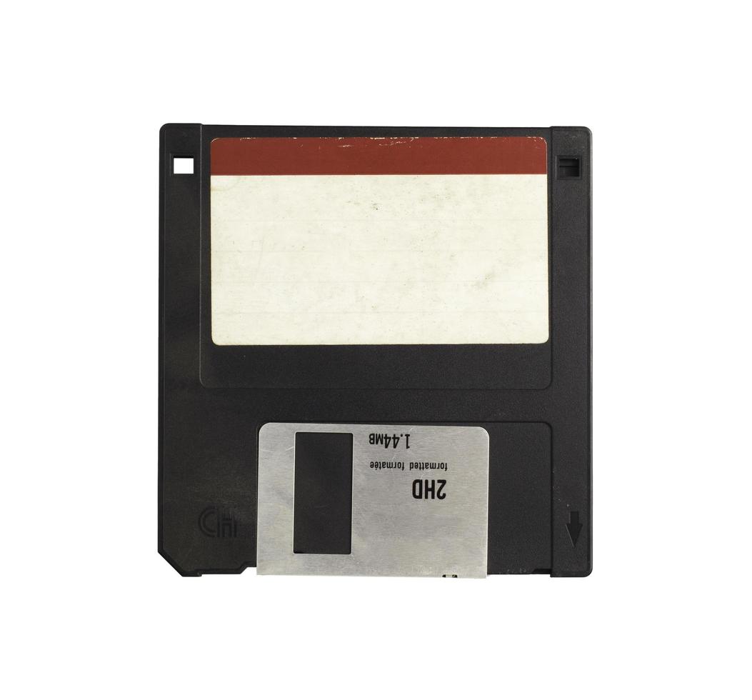 Black 3.5 floppy disk with tag for writing messages. on a isolate white background.Computer devices in the 90s for recording data.top-down,front view,top view,flat lay. photo