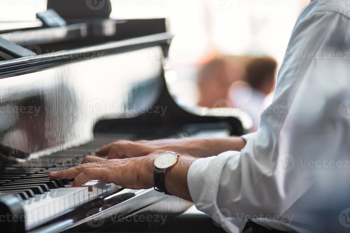 A pianist's hands on the keyboard photo