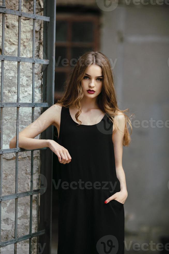 Attractive fashion woman in black dress photo