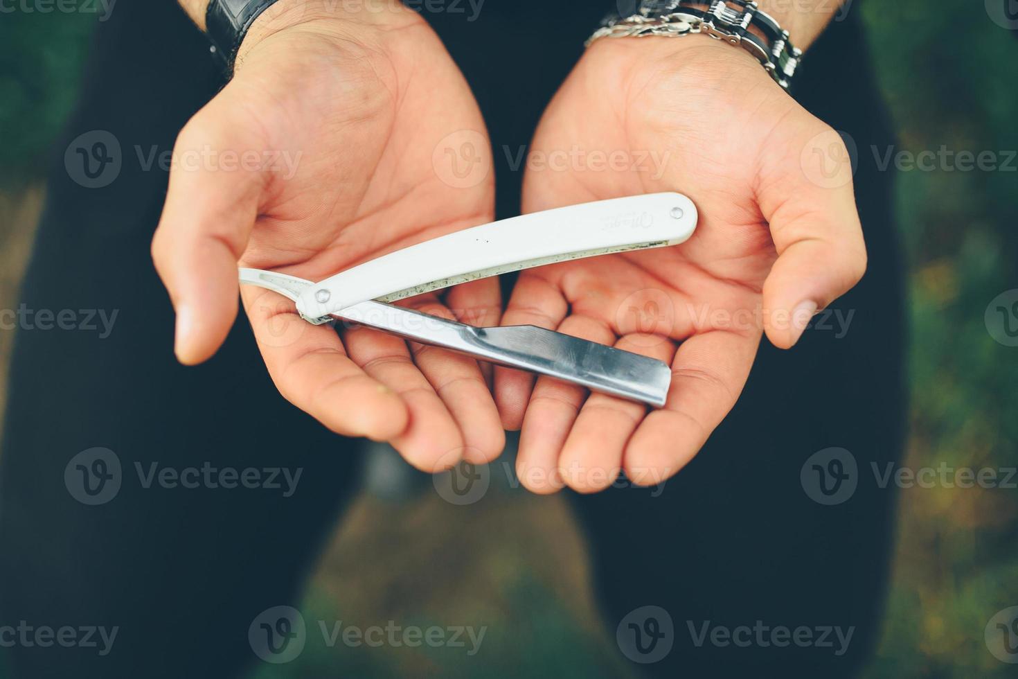 ancient blade in the hands of men photo