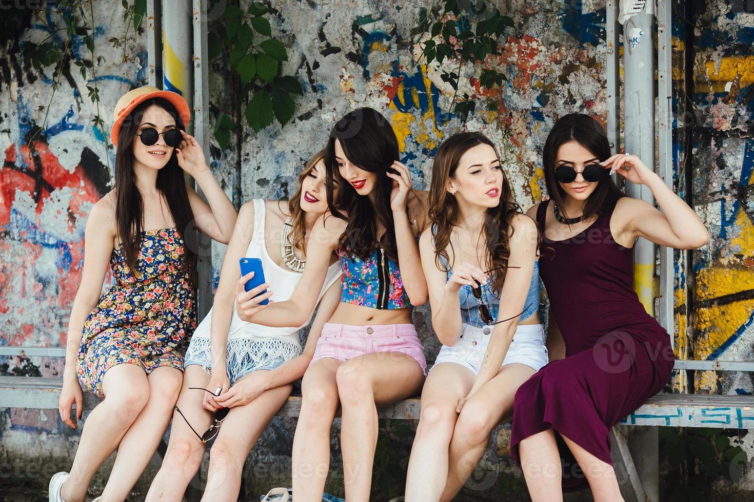 Five beautiful young girls relaxing photo