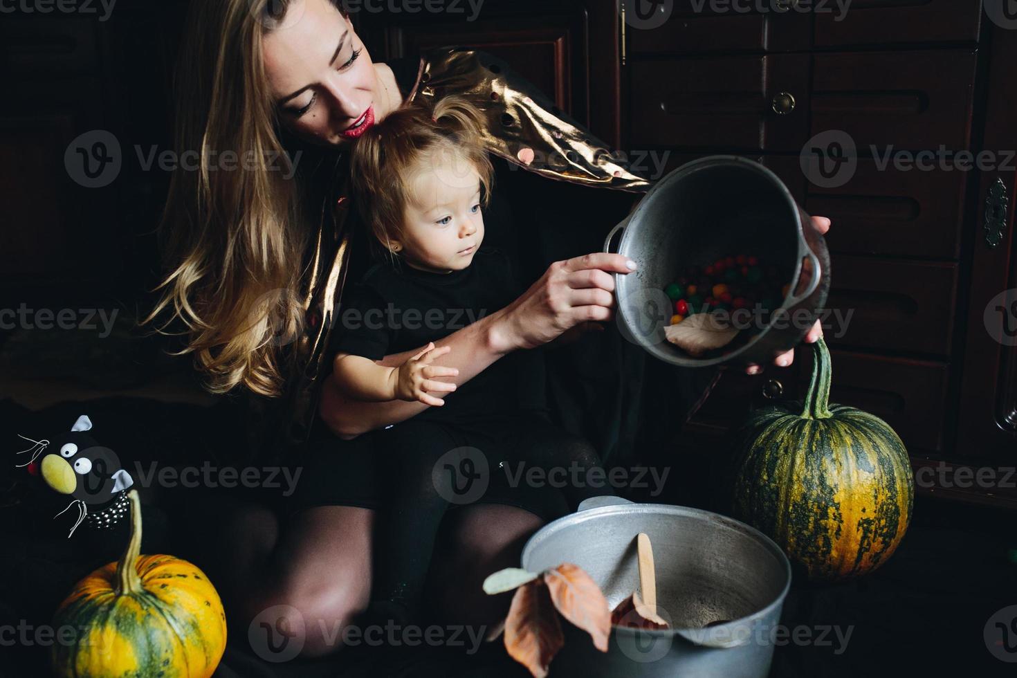 mother and daughter playing together at home photo