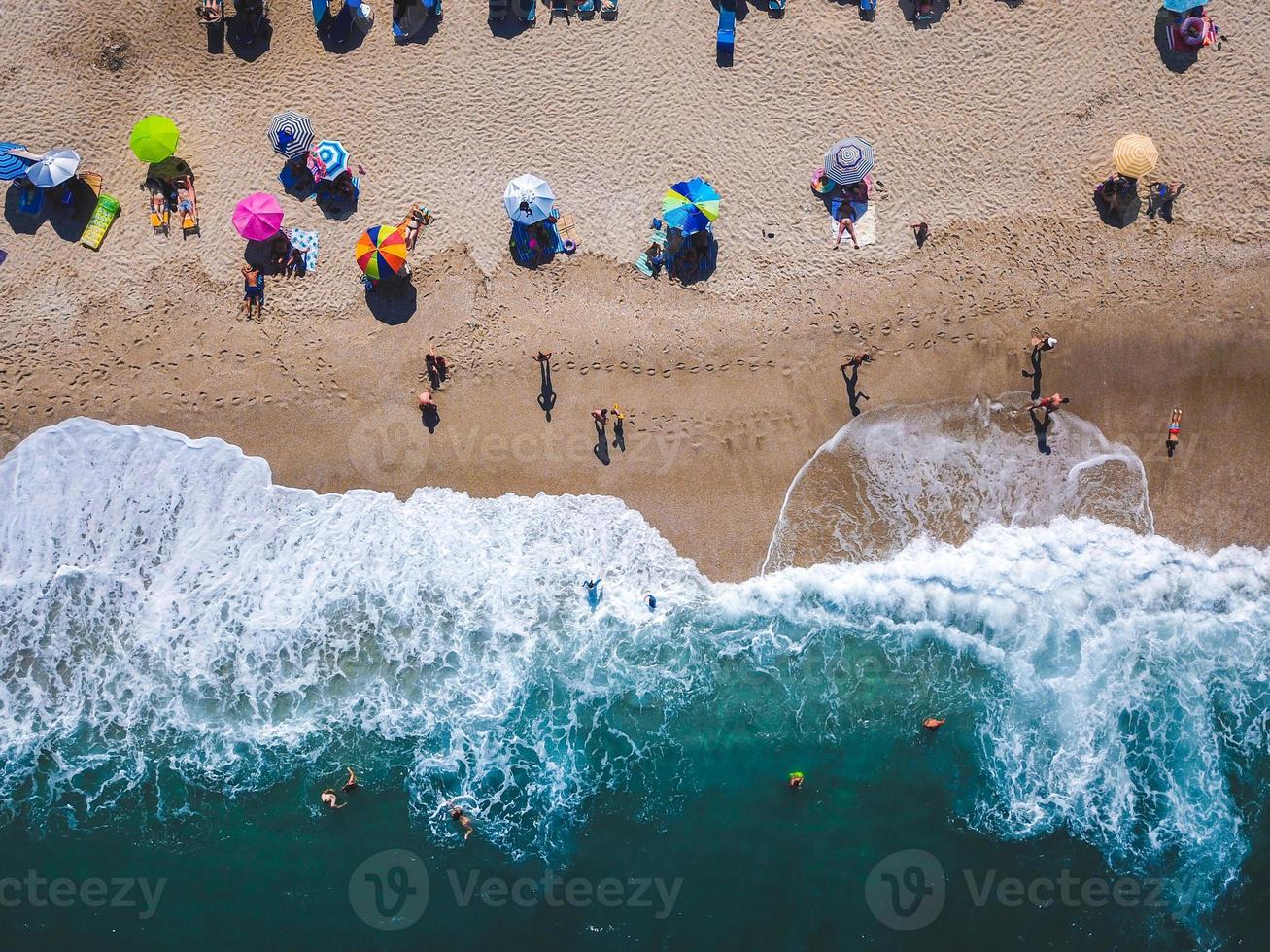 Beach with sun loungers on the coast of the ocean photo