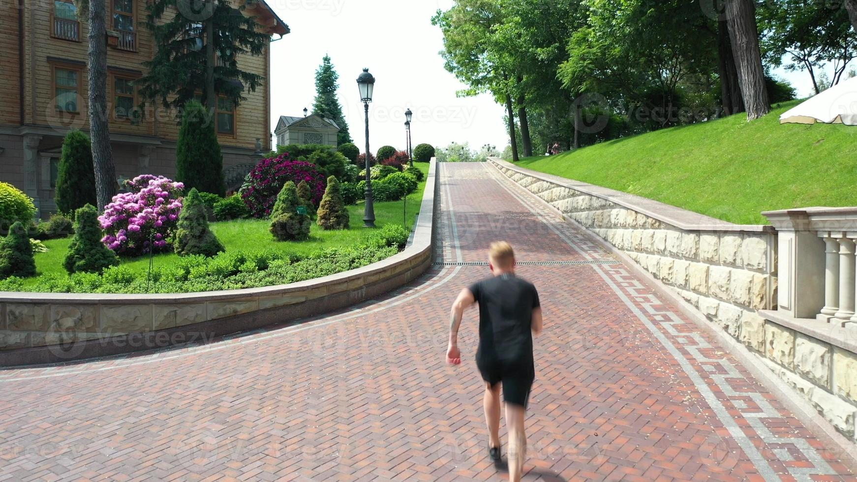 Male runner run in park at morning. photo
