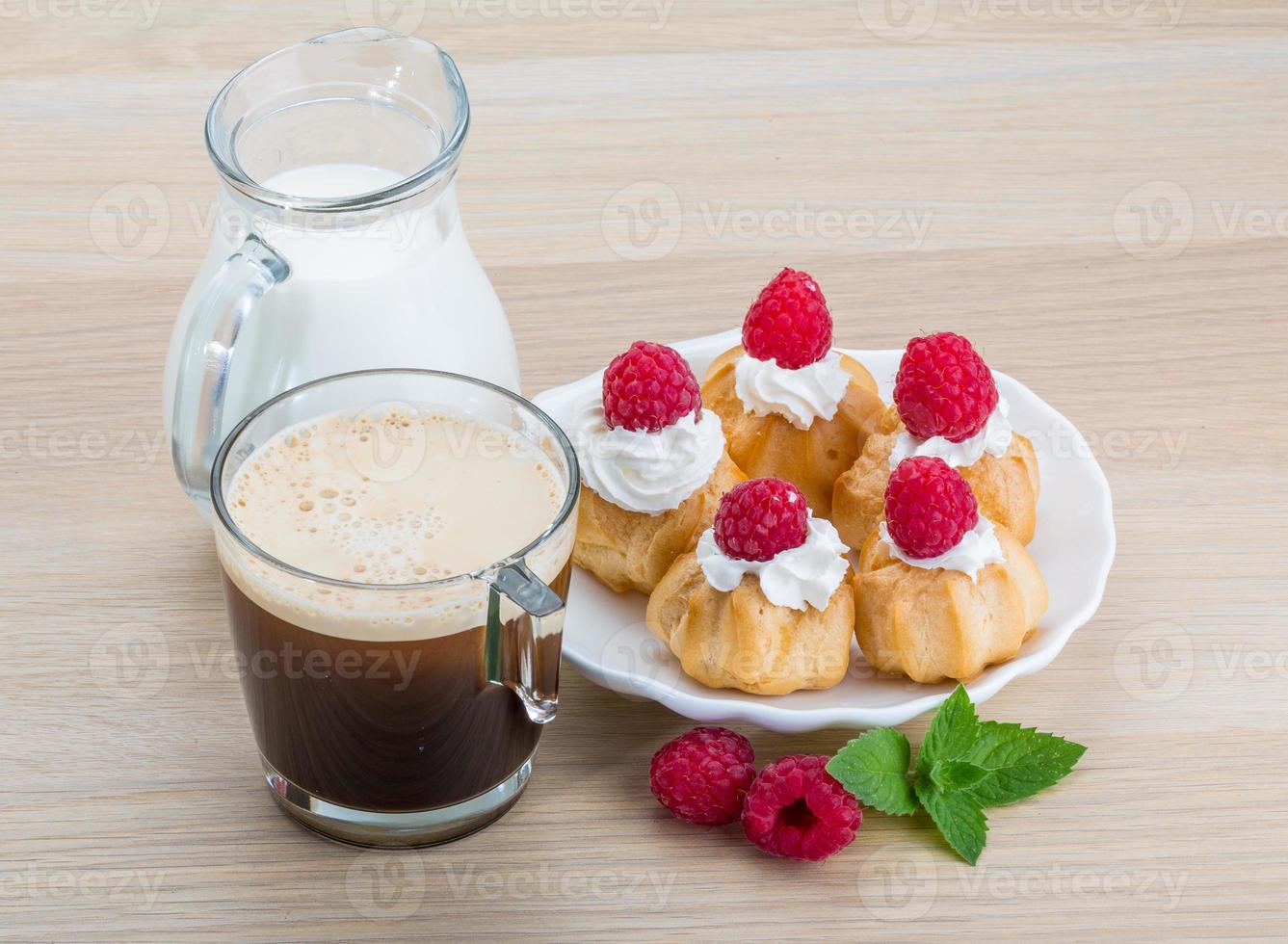 Profiterole with raspberry photo