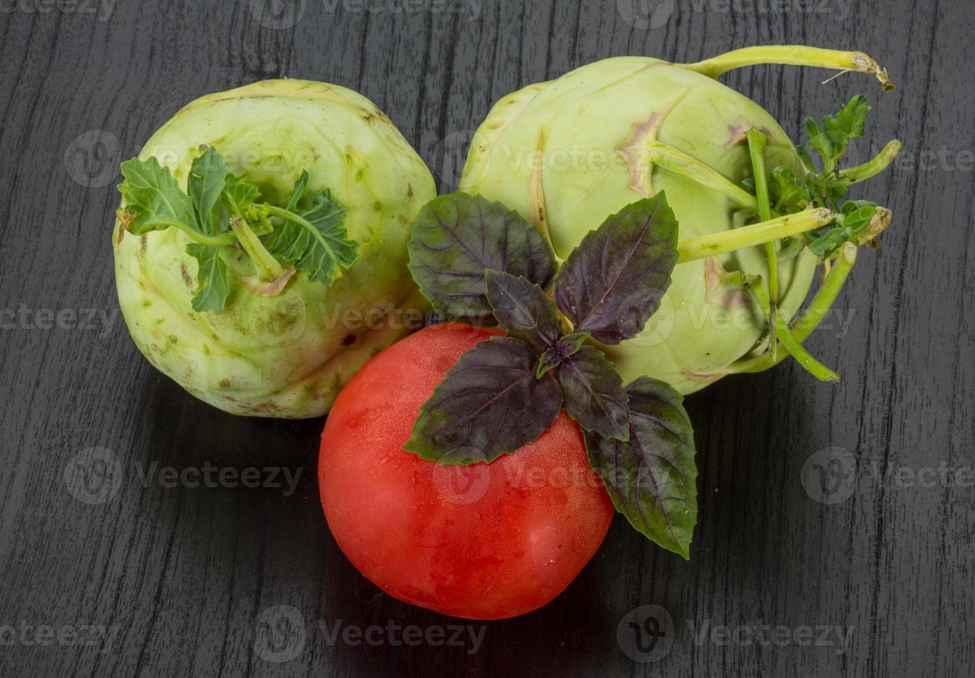 Kohlrabi on wooden background photo