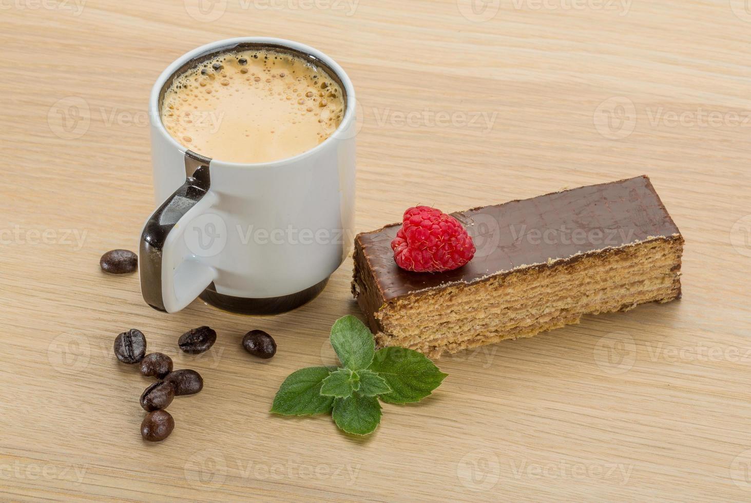Coffee with cake on wooden background photo