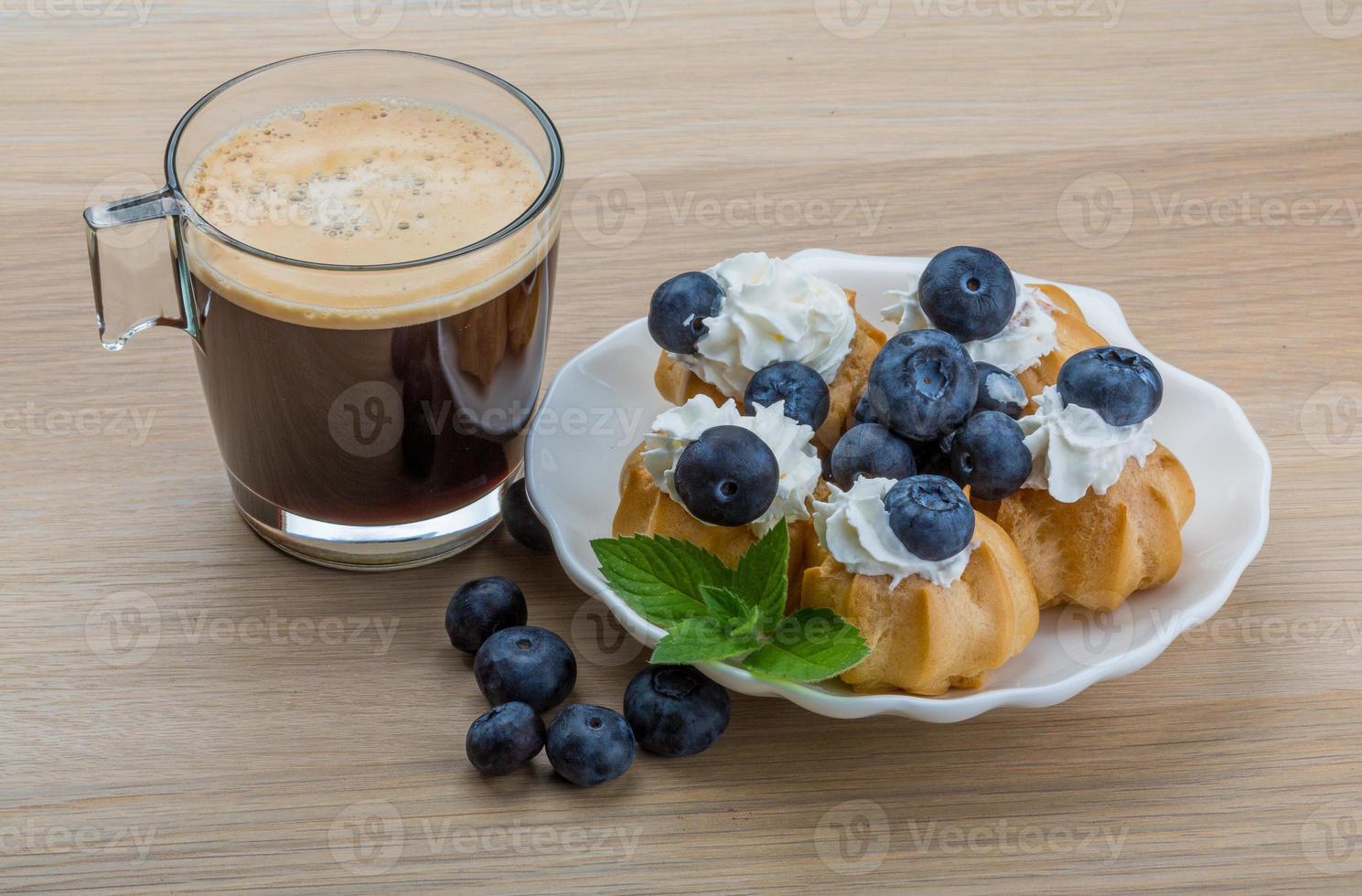 Profiterole with blueberry photo